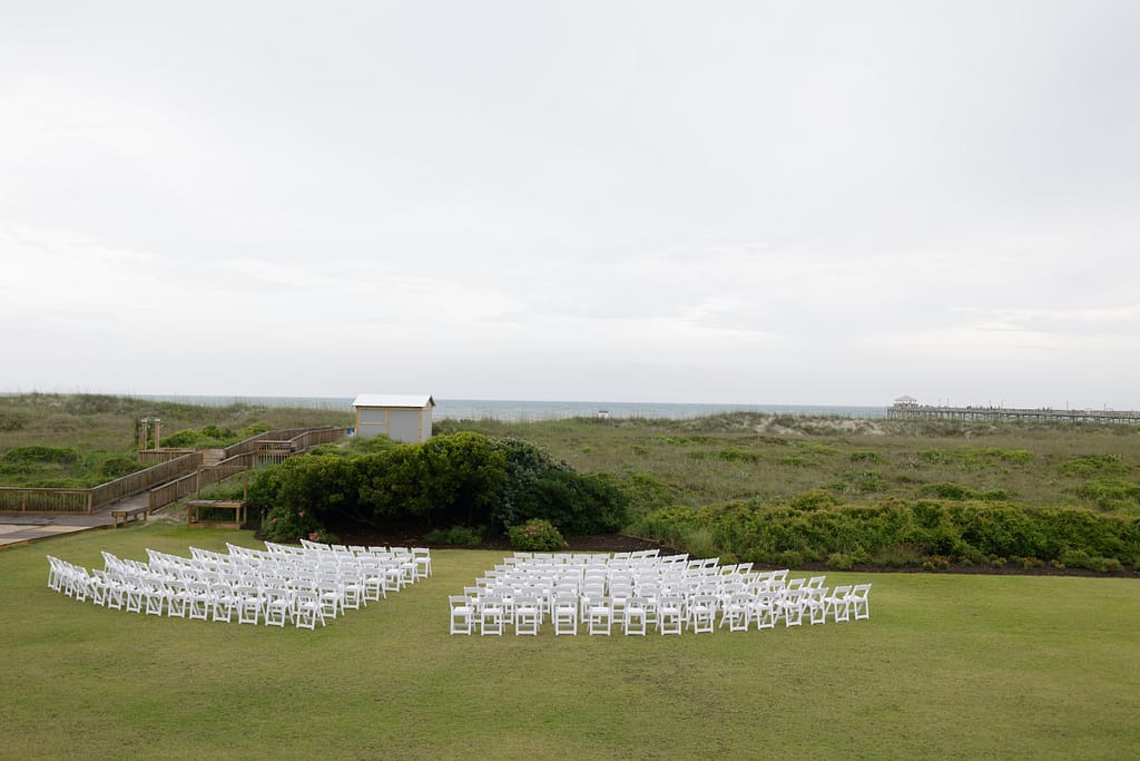 An outdoor wedding ceremony at the Beaufort Hotel in Beaufort, North Carolina overlooking the crystal coast. 