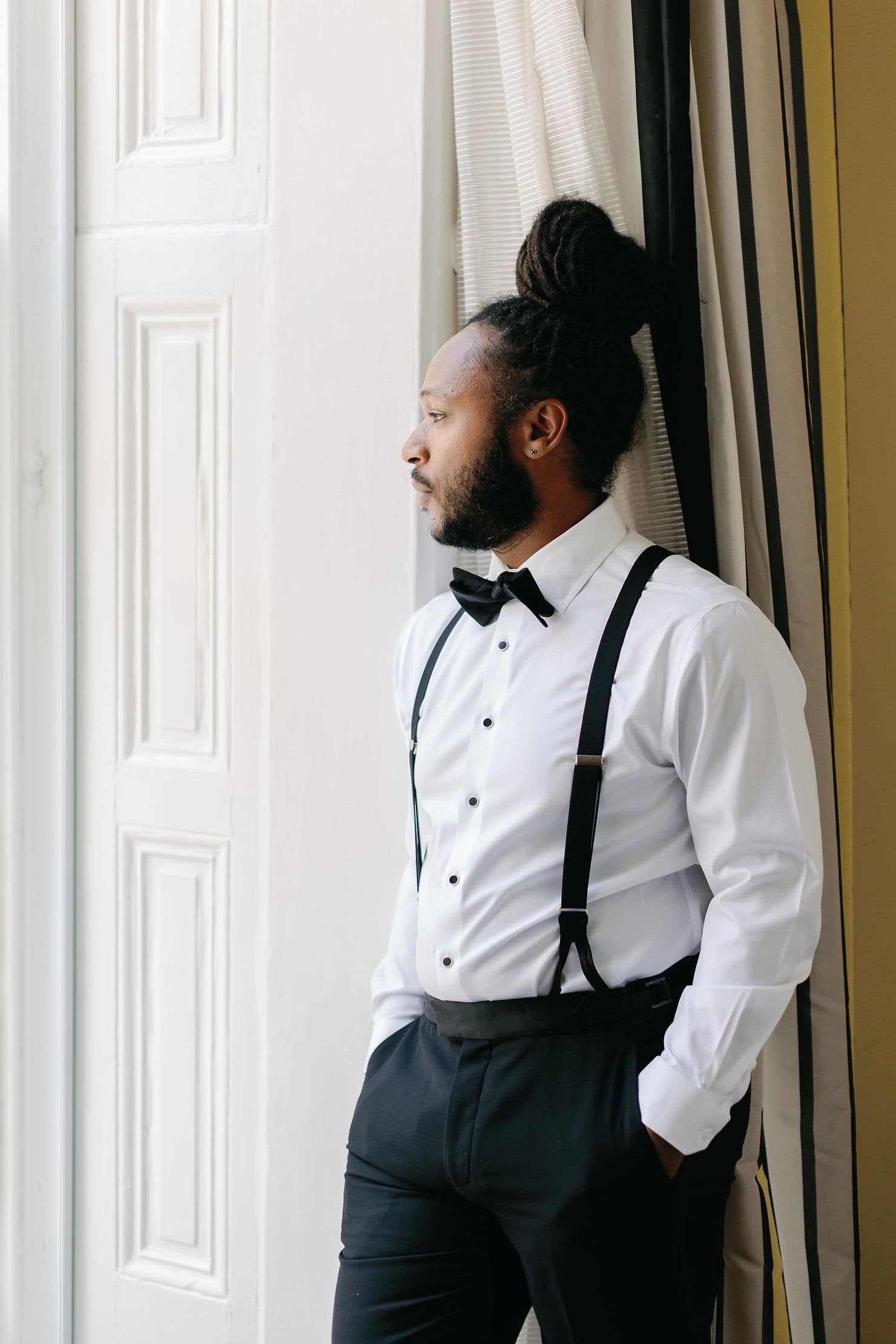 Groom getting ready portraits in the downtown Dc Kipton Monaco hotel in DC