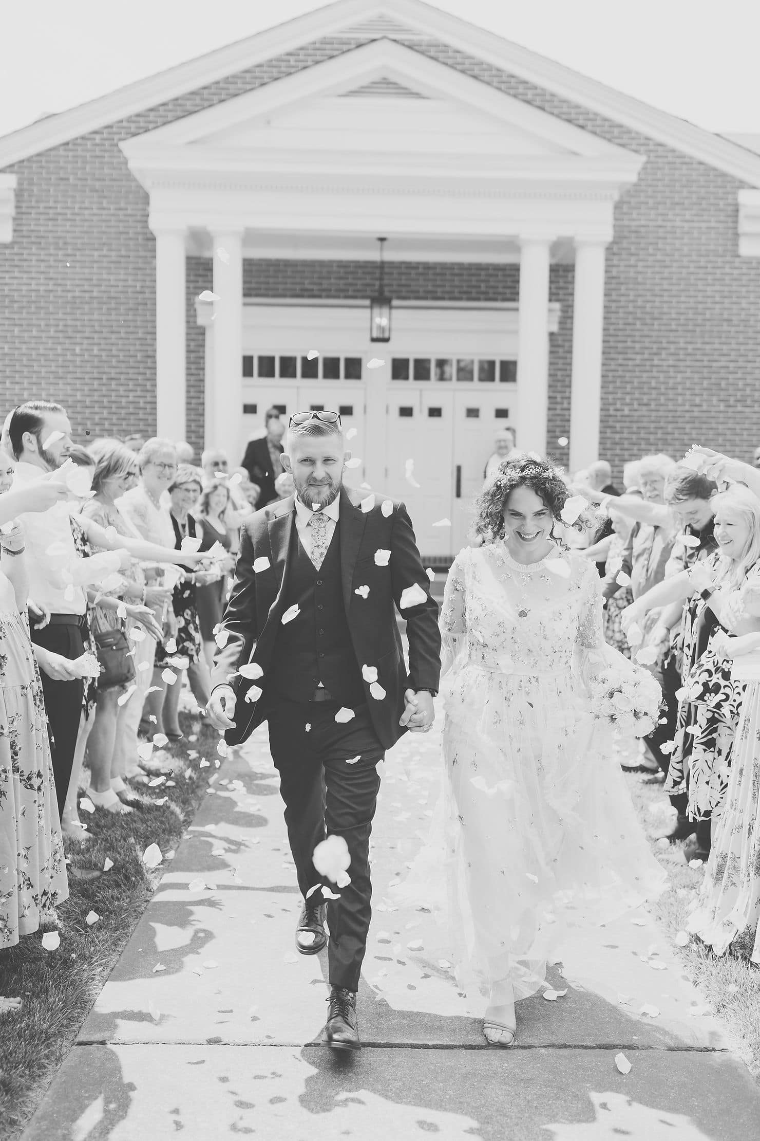 a sparkler exit alternative is a rose petal wedding exit toss for guests to enjoy