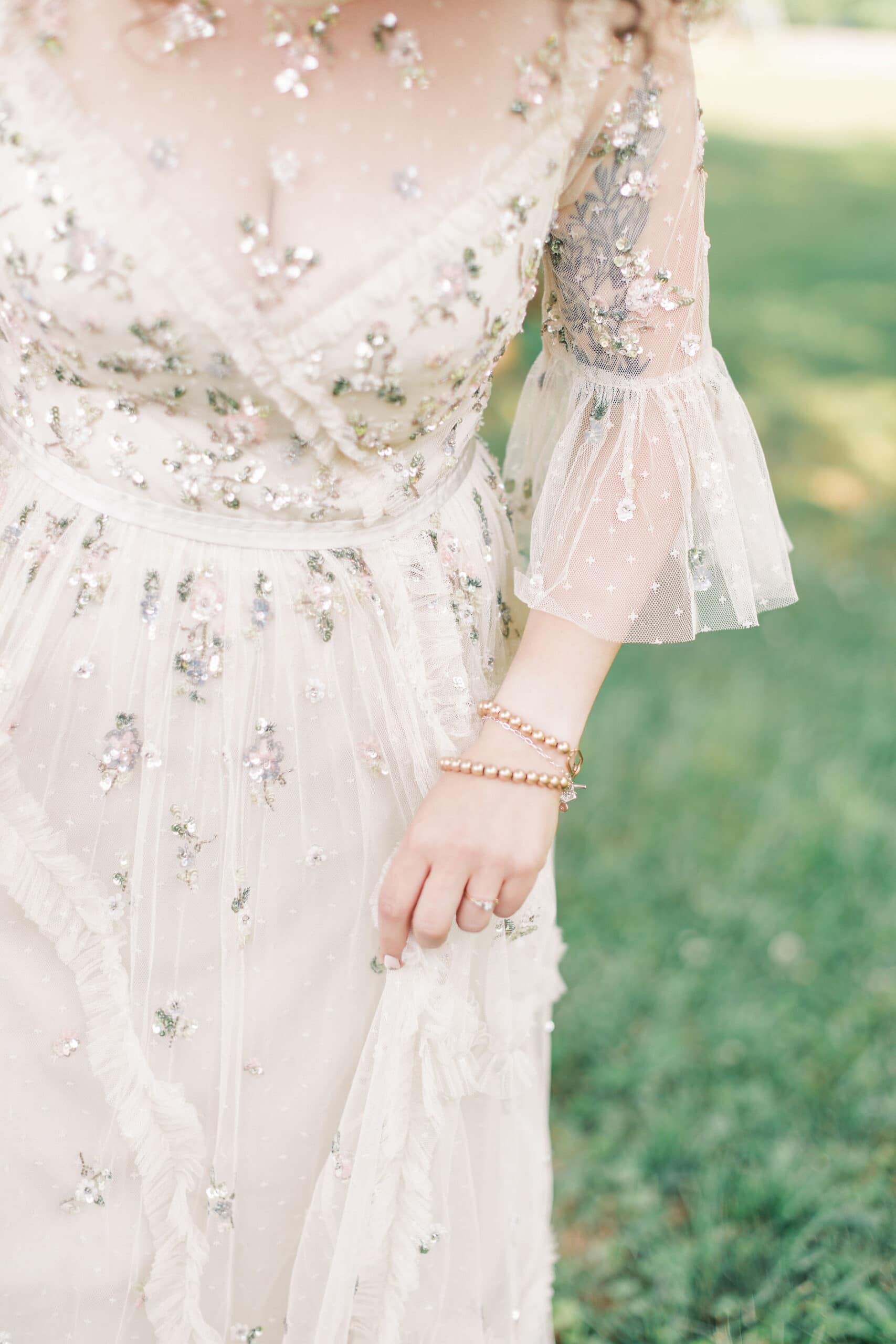 a needle and thread wedding dress with sequin and sparkle details in a film style photograph