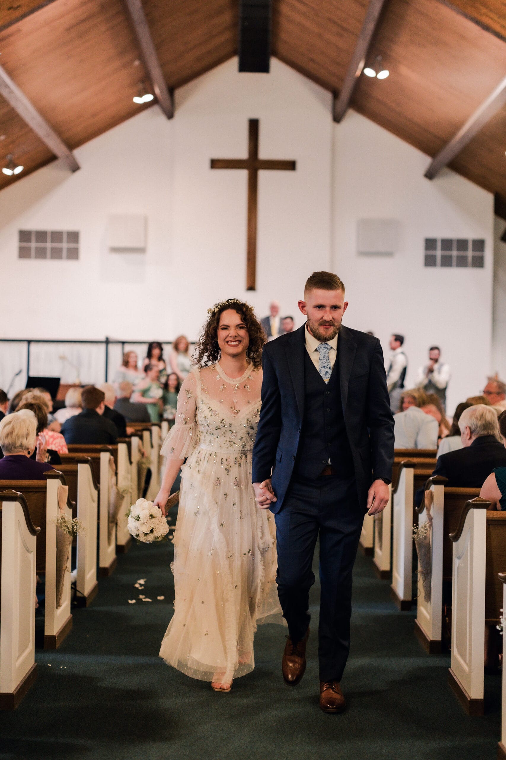 bride and groom walking down the aisle in maryland