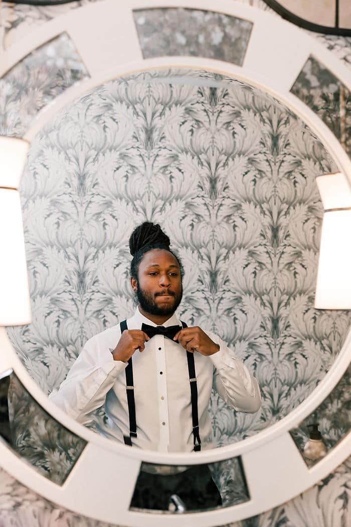 groom getting ready moments inside Hotel Kipton Monaco in Downtown district columbia