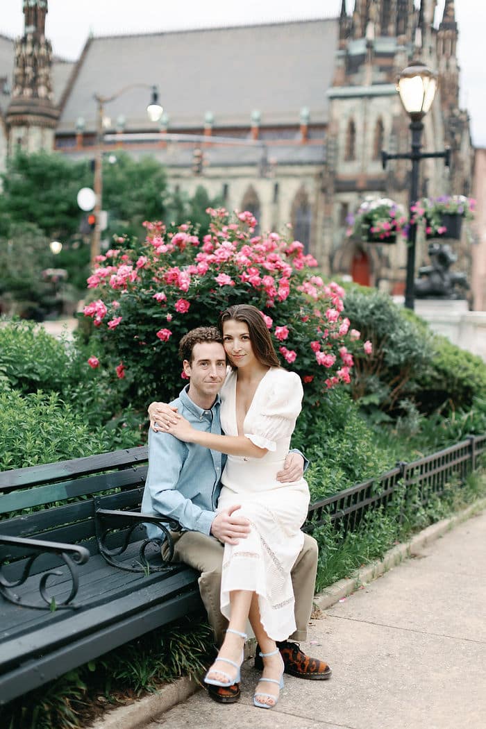 Intimate engagement moment, lush greenery, romantic kiss, Baltimore Maryland, outdoor love, natural beauty