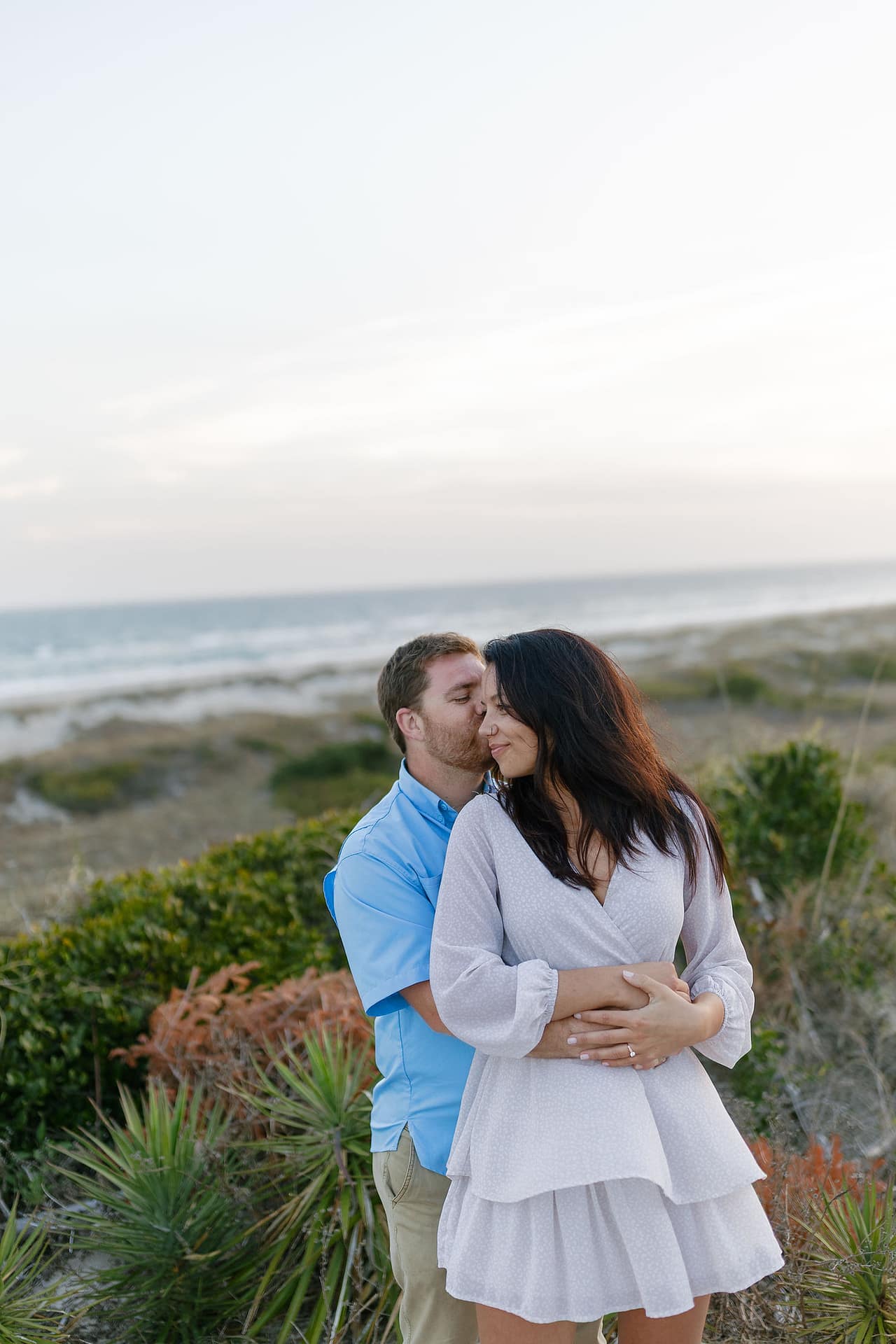 Romantic engagement photo during golden hour at Atlantic Beach, NC